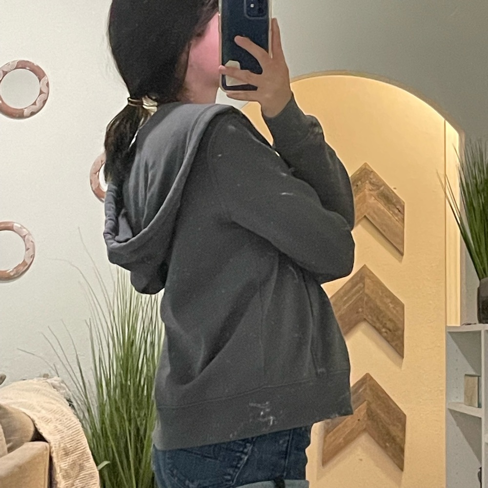 dark gray zip up jacket.